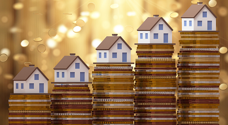 Small homes on stacks of coins for housing appreciation