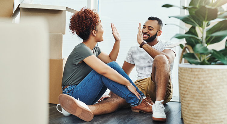 New homeowners high fiving