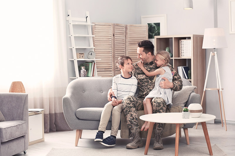 A family sitting in a Portland home purchase with a VA home loan.