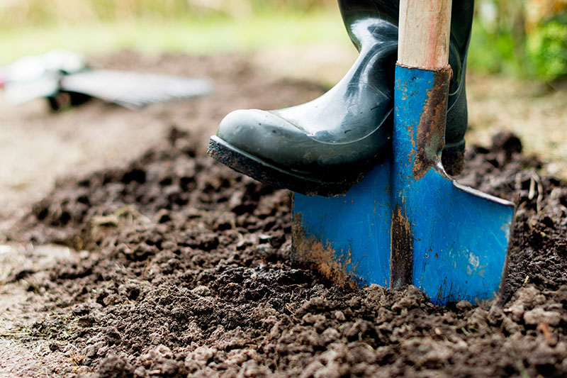 foot on shovel